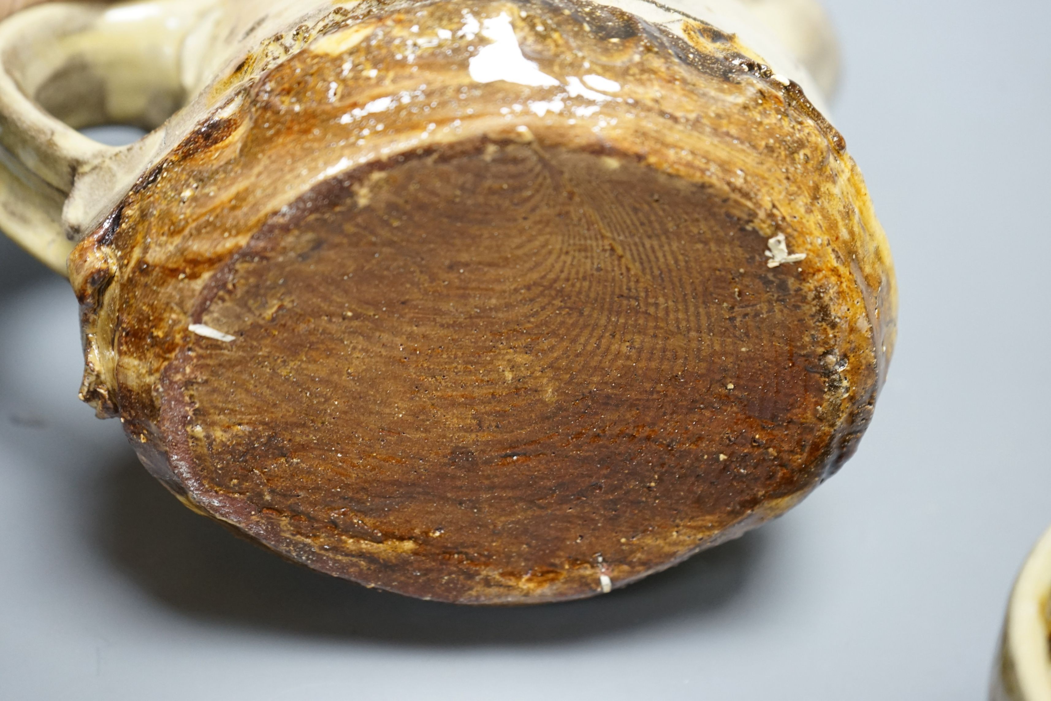 Jean-Nicolas Gérard (b.1954), a pale yellow and brown glazed earthenware jug and a similar bowl, with purchase receipt from Goldmark Gallery dated 09/04/2014, tallest 19.5cm, (2)